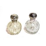 Two silver mounted cut glass scent bottles, the cut-glass bottles each globular, the silver mounts