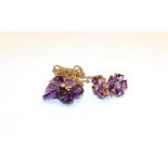 A 9 carat gold carved amethyst and diamond necklace, pendant length 2.3cm, chain length 45cm and a