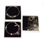 Two charm bracelets, by Pandora, hung with various charms and a Swarovski crystal bracelet, necklace