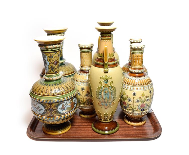 Mettlach vases in the traditional style comprising three pairs and one other similar, the largest