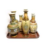 Mettlach vases in the traditional style comprising three pairs and one other similar, the largest