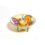 A Clarice Cliff Fantasque candle holder, in the Gay Day pattern, 11.5cm diameter