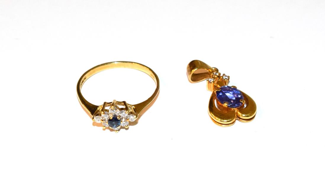 A tanzanite and diamond pendant, stamped 'K18', length 2.4cm; and an 18 carat gold sapphire and