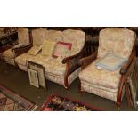 An early 20th century mahogany framed single cane three-piece bergere suite with carved hand grips