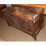 An early 18th century oak coffer, together with a rug (2)