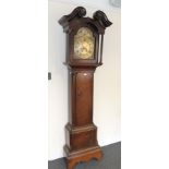 An oak thirty hour long case clock, the arched brass dial signed Taylor, Kirby, with another