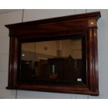 A reproduction mahogany veneered over mantle mirror