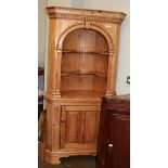 A George III style pine floor standing corner cupboard