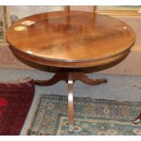 A regency style brass inlaid mahogany tilt-top circular breakfast table, 106cm diameter by 73cm