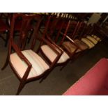 Six dining chairs comprising two rush seated ladder-back chairs, two mahogany inlaid dining