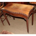 A George III mahogany serpentine front card table