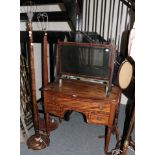 * An early 19th century mahogany kneehole bow-front dressing table, an arrangement of three
