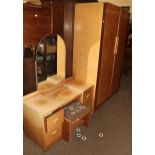 An Art Deco burr walnut veneered four-piece bedroom suite comprising, double wardrobe, single bed,