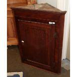 A George III oak and mahogany inlaid corner cupboard