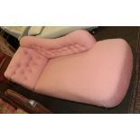 A late Victorian chaise lounge upholstered in pink fabric, raised on turned legs