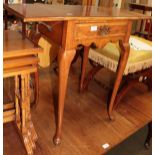 An 18th century style burr walnut veneered occasional drop leaf table with single drawer on pad