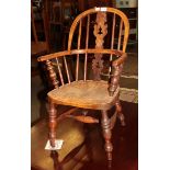 A 19th century yew child's Windsor chair