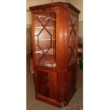 Two modern floor standing corner cabinets, glazed