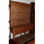 A reproduction oak dresser and rack, 143cm width by 42cm depth by 198cm height
