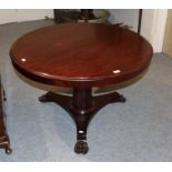 A 19th century circular topped mahogany pedestal table with tapering faceted standard on a waisted