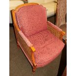 A 20th century bergere armchair, the sides with double caning