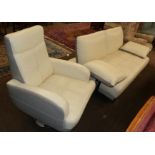 A modern leatherette two-seater sofa together with a matching swivel armchair