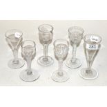 Four 18th century opaque twist glasses, of various designs and forms; together with an 18th