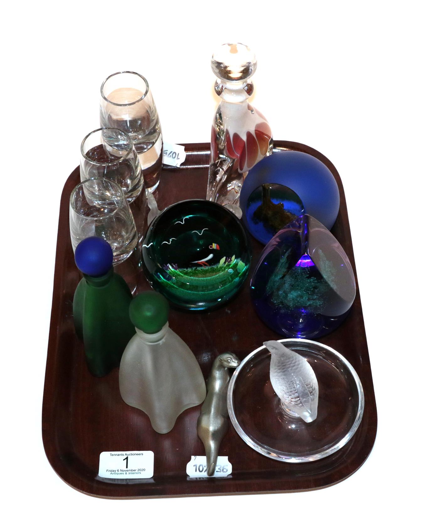 A tray of art glass including three Caithness paperweights, a Lalique ring stand and three