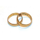 Two 22 carat gold band rings, finger sizes N and N1/2. Gross weight 7.68 grams.