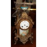 A gilt metal porcelain mounted striking mantel clock, circa 1890