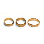 Three 22 carat gold band rings, out of shape. Gross weight 10.19 grams