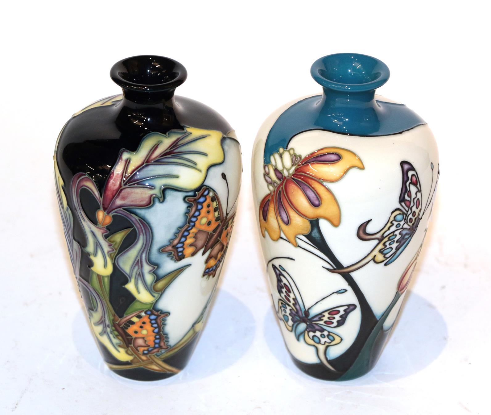 Two Moorcroft butterfly vases (2). 16cm high and in good condition.