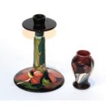 A Moorcroft Mackintosh style candlestick with a miniature vase (2).