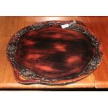 A Japanese lacquered tray, Meiji period, twin handled, relief floral border, signed, 52cm diameter