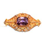 An amethyst, seed pearl and diamond brooch in a matte finish frame, unmarked, length 7.2cm . Gross