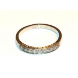 A diamond quarter hoop ring, unmarked, finger size Q. Gross weight 3.0 grams.