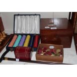 A cigar humidor with silver cigar cutter, two boxes of games counters, a walking stick and