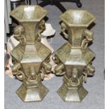 A pair of carved hardstone hexagonal baluster vases of Oriental design