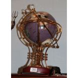 An Osborne & Allen illuminated and rotary globe, with elaborate gilt metal frame, on plinth base