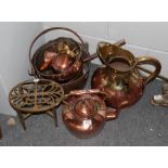 A selection of copper and brass ware including jug, copper kettle, trivet, pedestal bowl, jam pan,