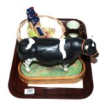 A Royal Worcester porcelain figure of a Holstein-Friesian bull by Doris Lindner, with stand and