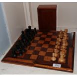 A Stanton Jacques chess set with associated board