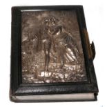 A Victorian photograph album containing assorted family portraits