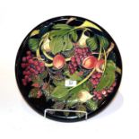 A Moorcroft pomegranate pattern charger