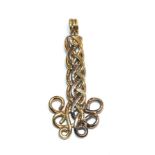 An 18 carat two-colour gold pendant, length 4.4cm. Gross weight 6.9 grams.