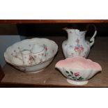 A Grimwade's wash basin and water jug; a Devon ware five piece wash set; a Malin lustre bowl; a