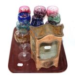Ten assorted coloured hock glasses; and an early 20th century French style display cabinet in the