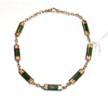 A nephrite chain, stamped '9' and '.375', length 42cm . The chain is in good condition, with
