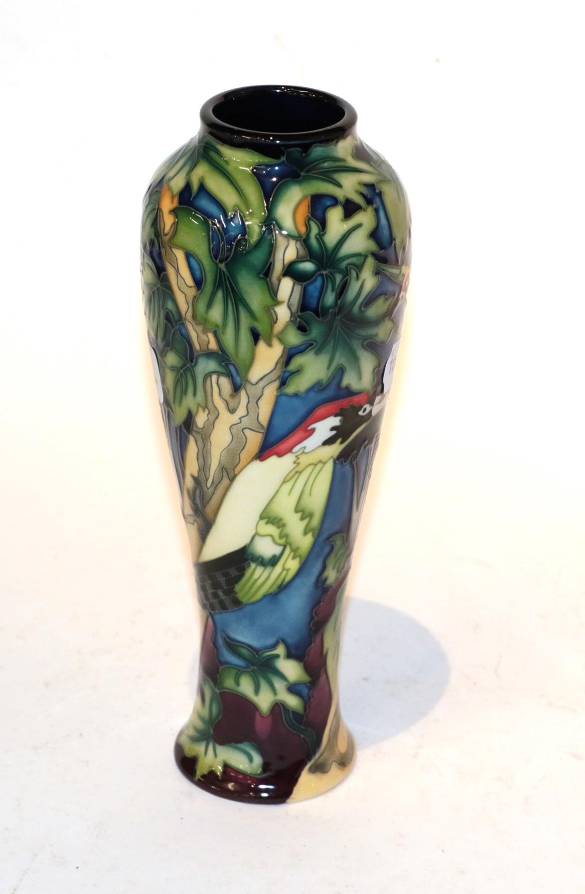 A Moorcroft green woodpecker vase. 26cm high. Good condition.