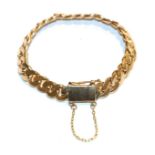 A curb bracelet, clasp stamped '18K', length 20cm . Gross weight 49.6 grams.